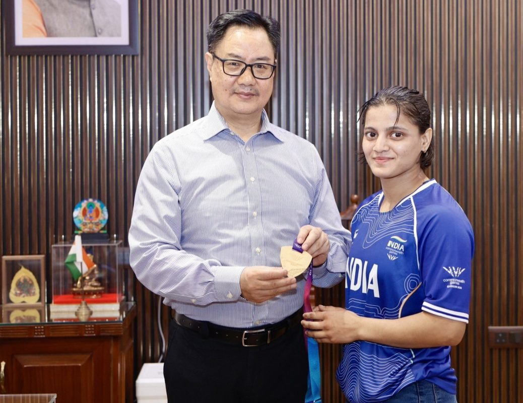 Union Minister Kiren Rijiju felicitates Commonwealth Games 2026 judo gold medallist Asmita Dey alongside her coach Yashpal Solanki.
