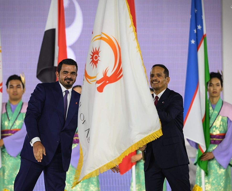 OCA President Sheikh Joaan bin Hamad Al Thani hands the OCA flag and Asian Games torch to Qatar ahead of Doha 2030