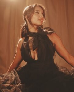 Triptii Dimri’s full-length look featuring a plunging neckline and sheer fabric.